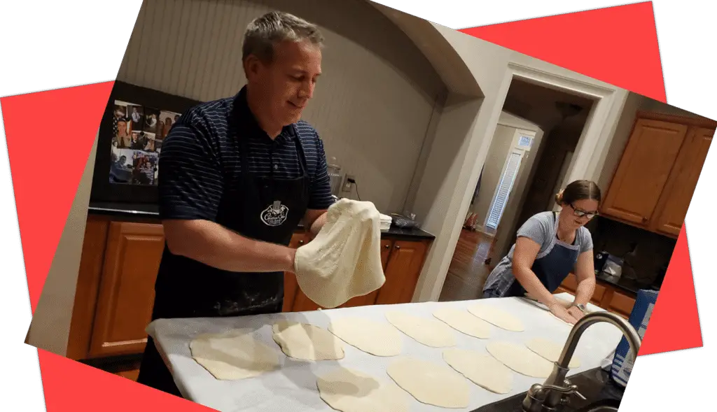 father and daughter make and stretch pizza dough for a birthday party camping or tailgating